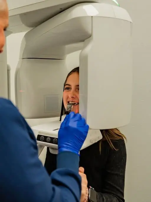 Children's orthodontics at Chauncey Orthodontics in Henderson, NV. A young patient receives a dental scan from an orthodontist.