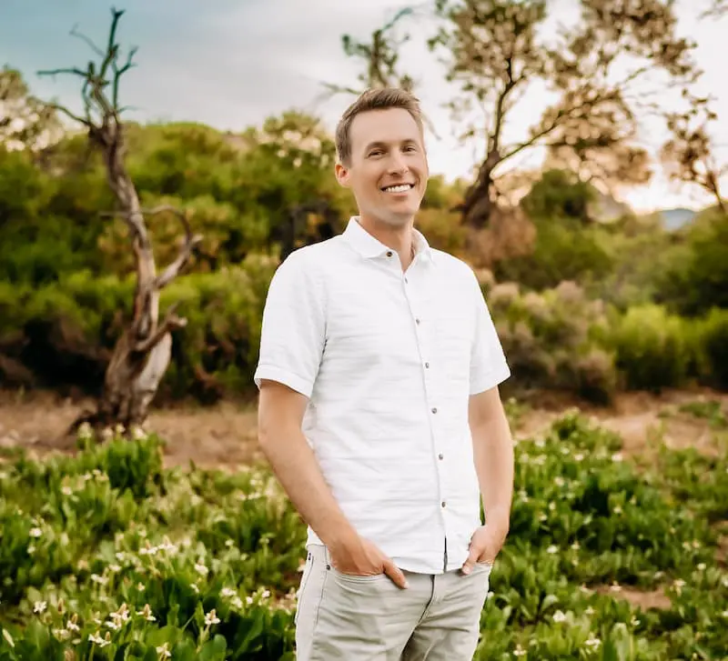 Dr. Tate Chauncey is orthodontics experts of Chauncey Orthodontics in Henderson, NV smiles outdoors. The clinic provides orthodontic care.