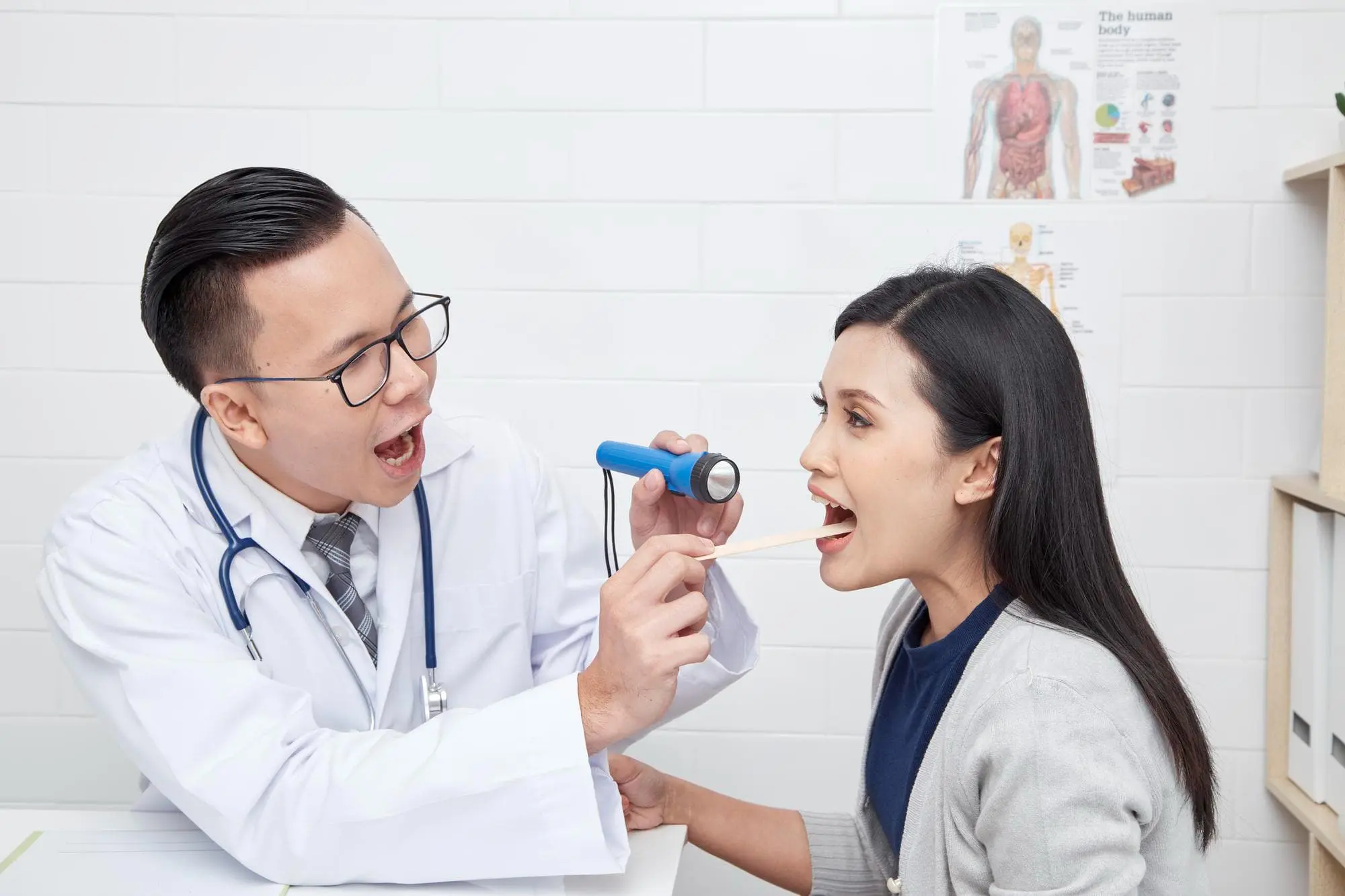 A doctor to carefully conduct a procedure on a patient with tongue thrust issue at Chauncey Orthodontics in Henderson NV.
