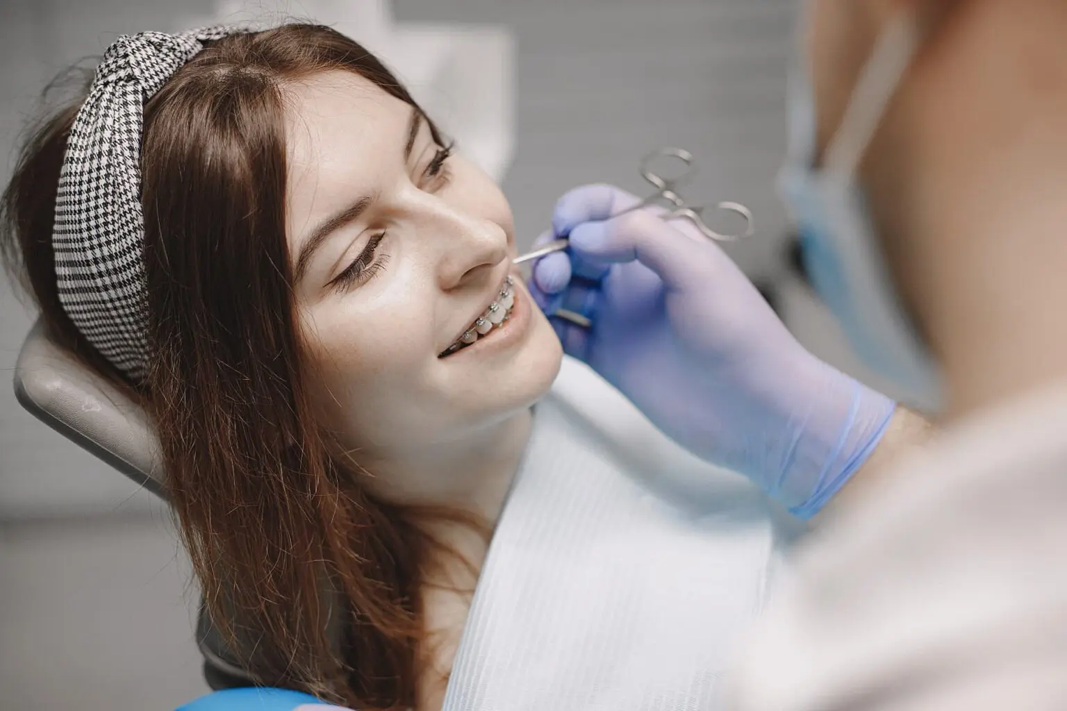 a woman smile with braces, she find affordable braces from Chauncey Orthodontics in Henderson, NV.