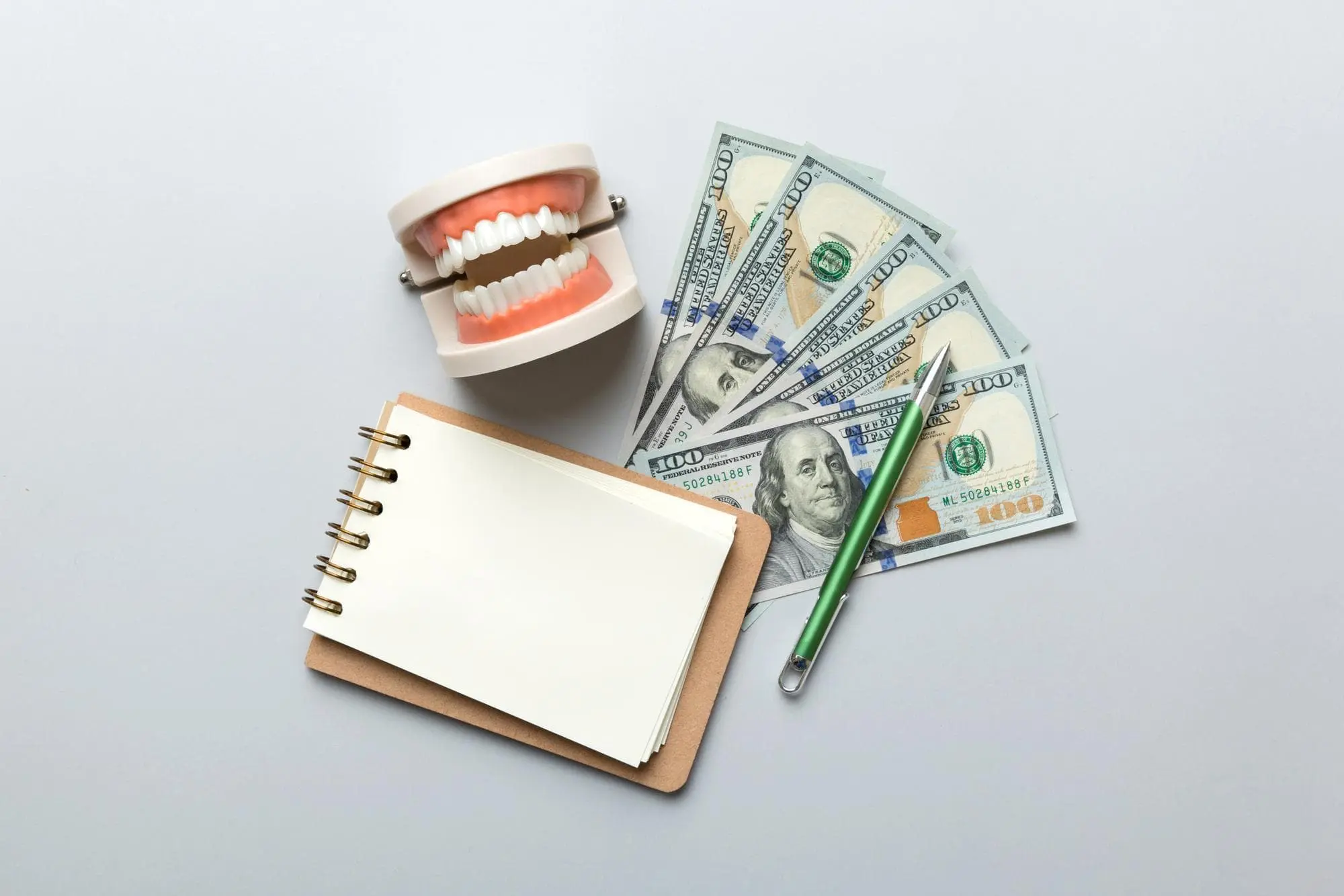 A model of human teeth with metal braces illustrating potential costs at Chauncey Orthodontics in Henderson, NV.