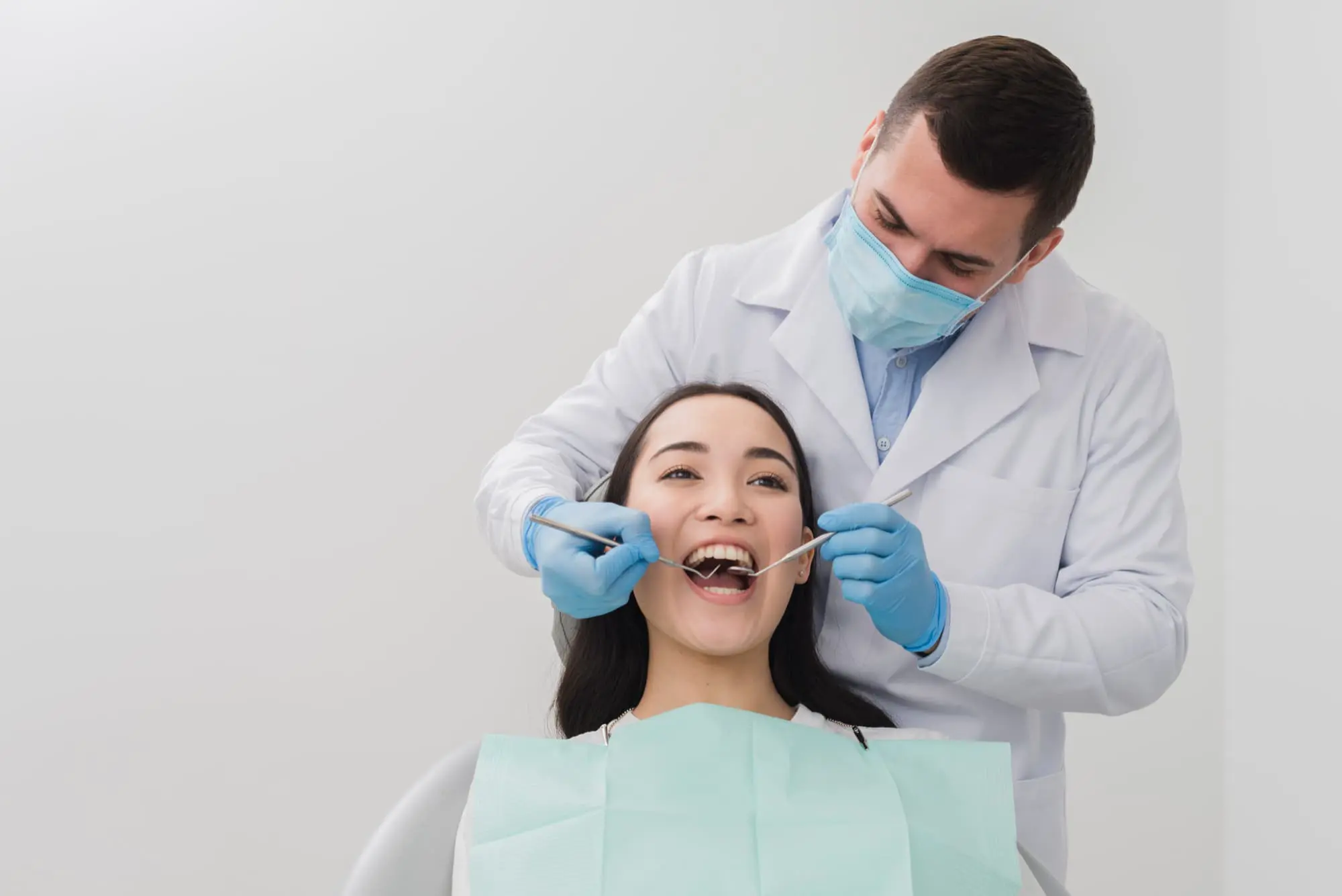 At Chauncey Orthodontics in Henderson NV, a dentist discuss a palatal expander with a smiling patient.